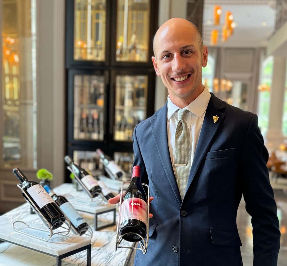 Stefano Barbarino holding bottle of wine
