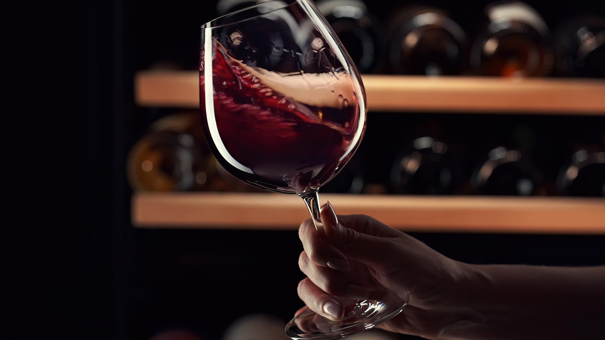 cabernet sauvignon guide - glass of red wine in wine cellar