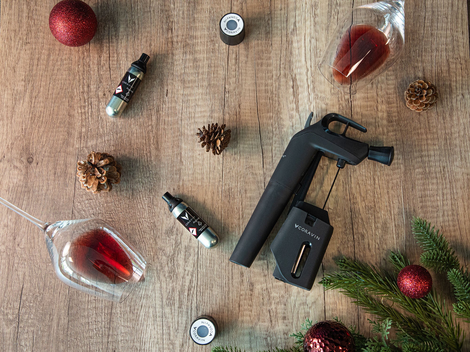 Wine by-the-glass-system on a wooden surface with Christmas decorations