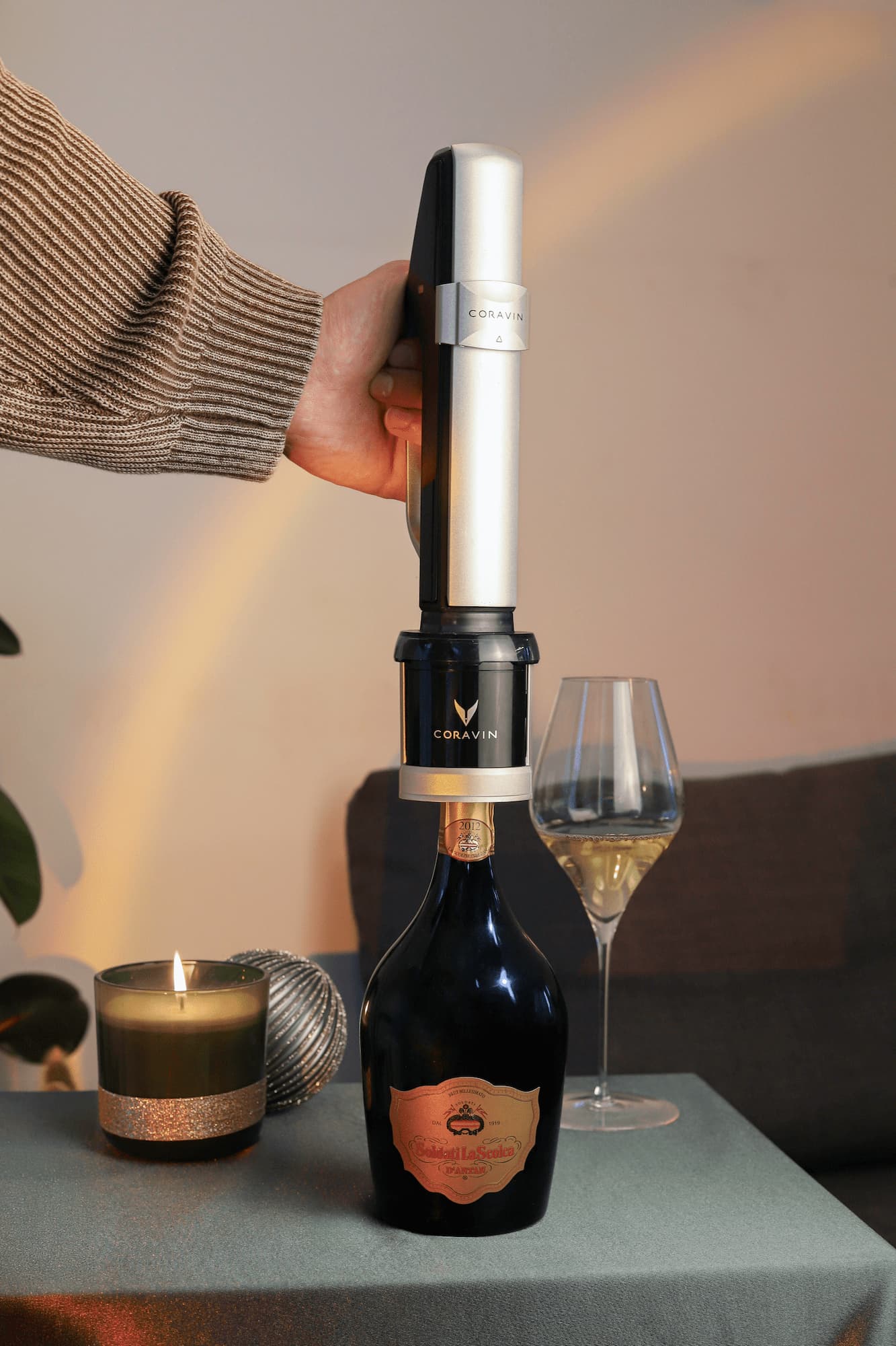 wine lover using coravin sparkling universal stopper