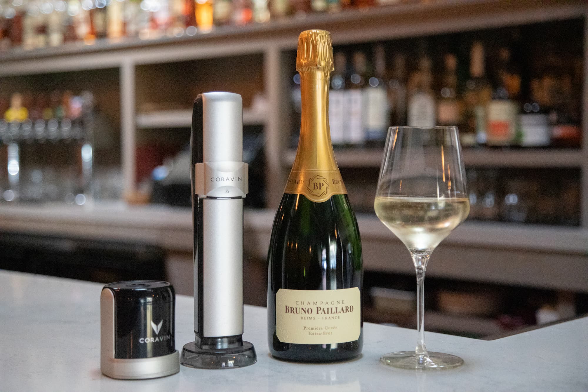 A bottle of Champagne with a Coravin Sparkling wine-by-the-glass stopper