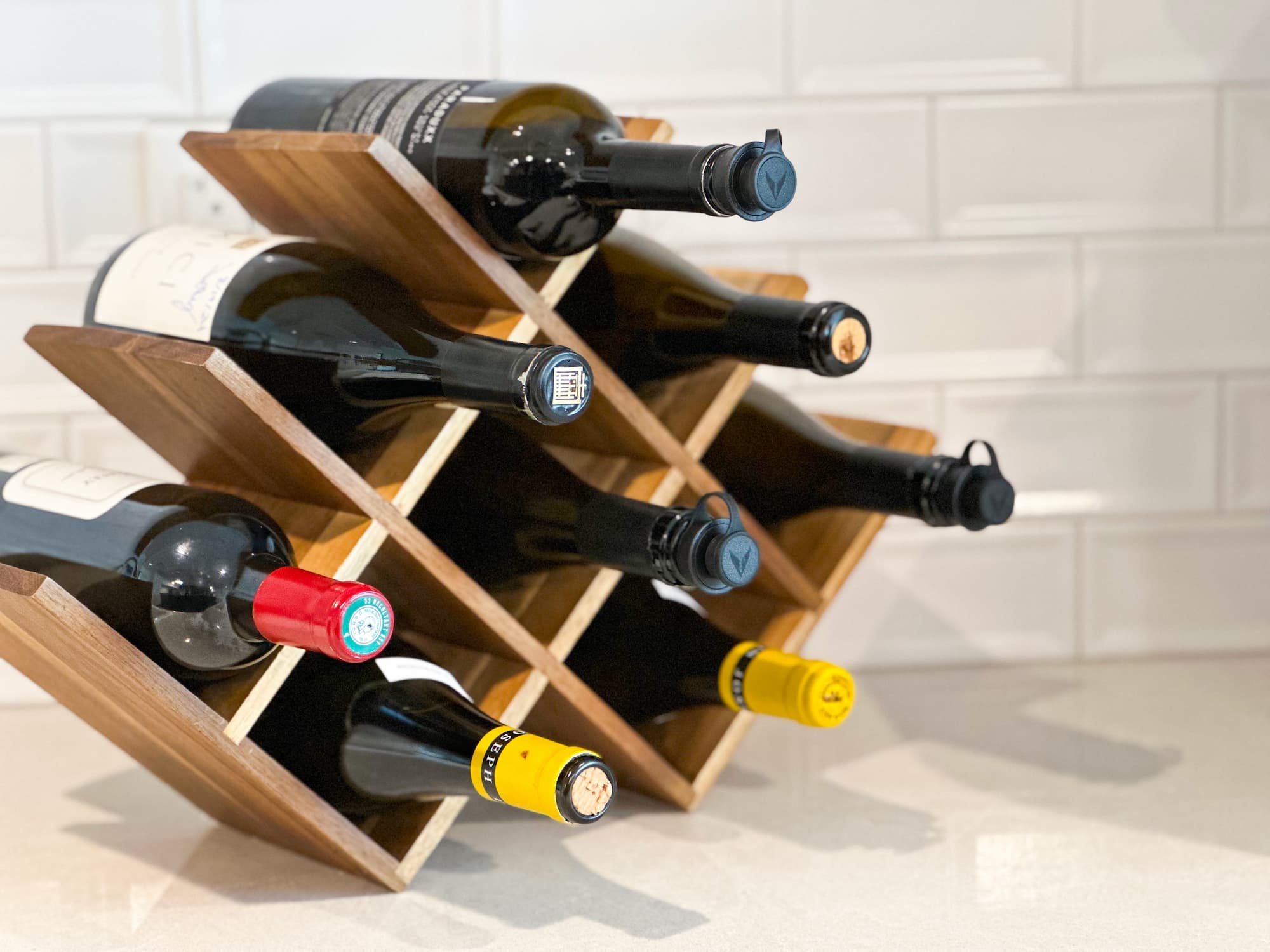 wine rack showcasing bottles sealed with coravin stoppers, enabling effortless access and preservation