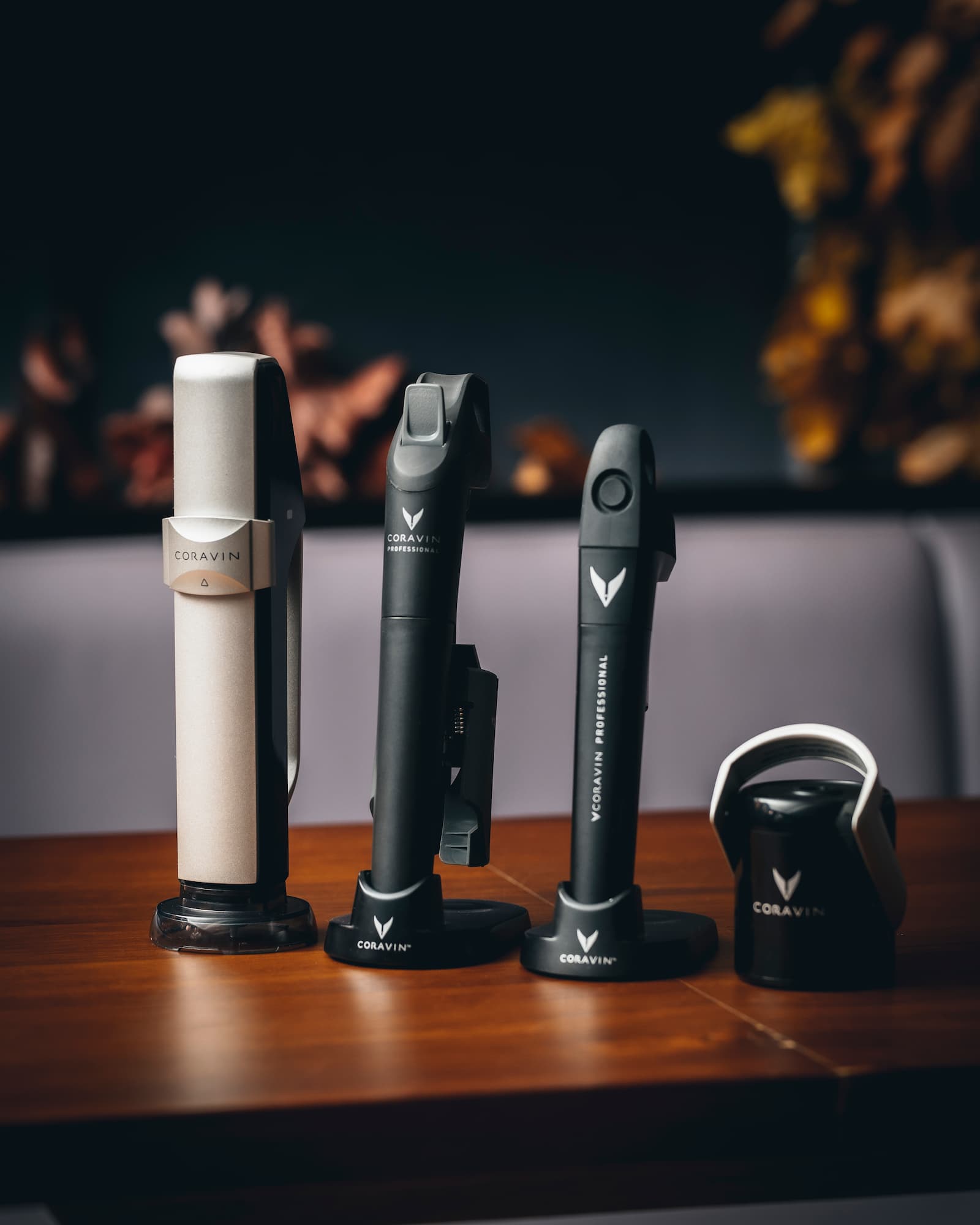 coravin wine stopper systems displayed on a wooden surface